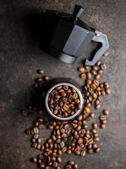 Coffee beans and bialetti coffee maker. Moka pot